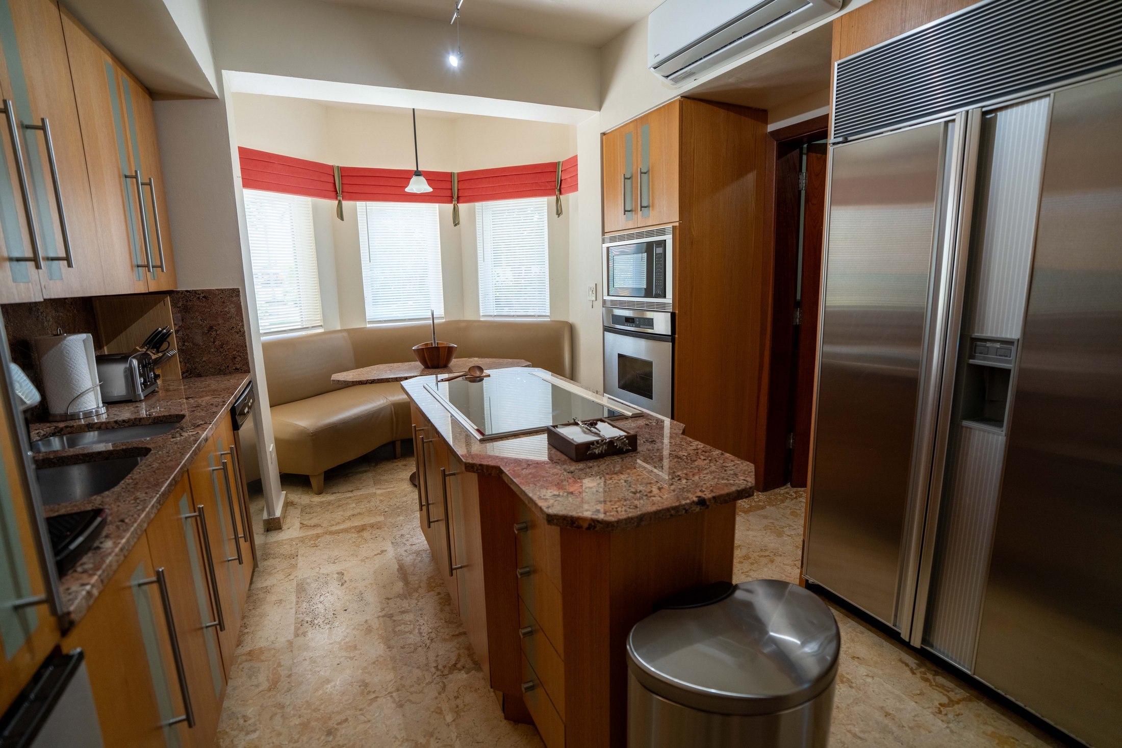 Full kitchen with granite island and stainless appliances
