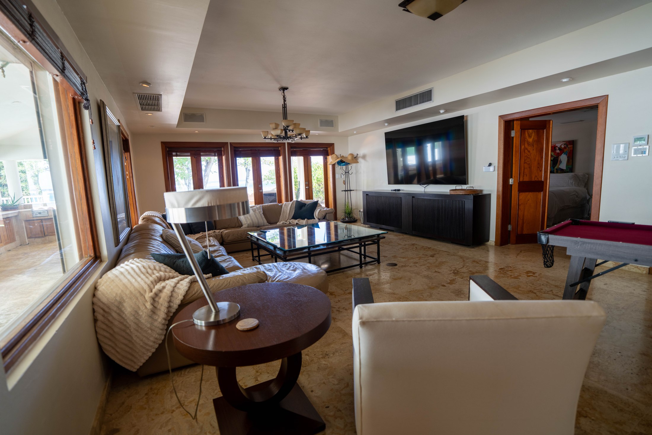 Great room with marble floors and natural light